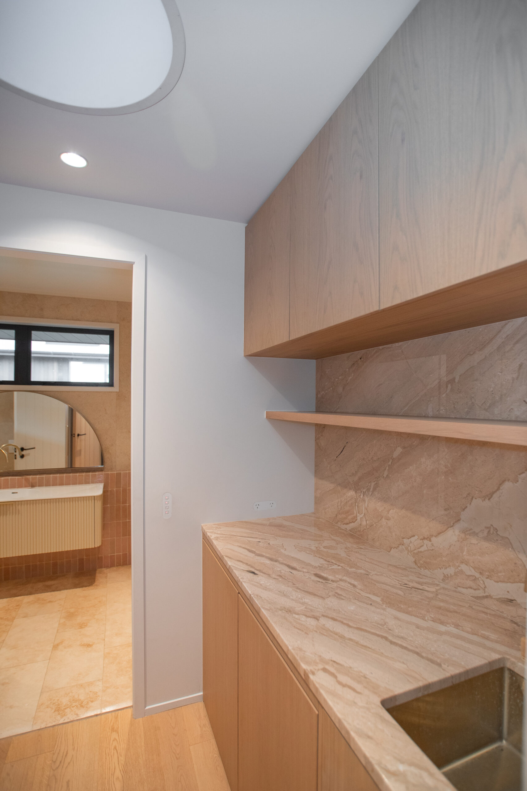 Laundry sink area with luxe stone bench top